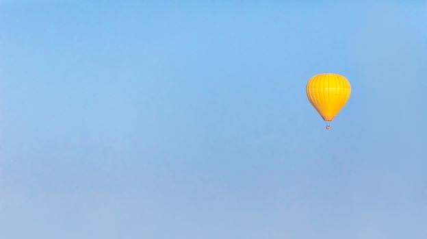 Yellow balloon in the sky