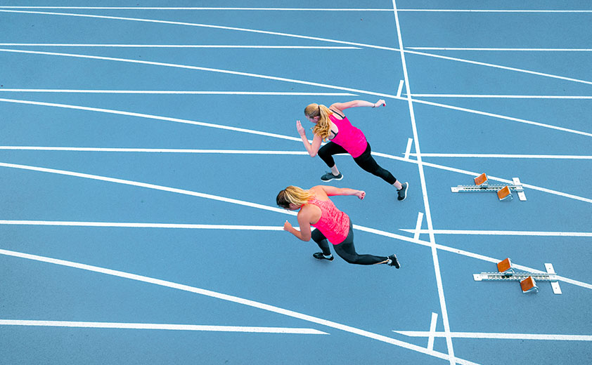 two women runners in pink tops