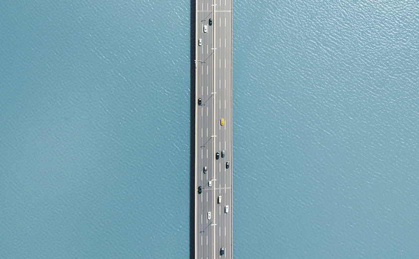 Aerial view of cars on bridge over water