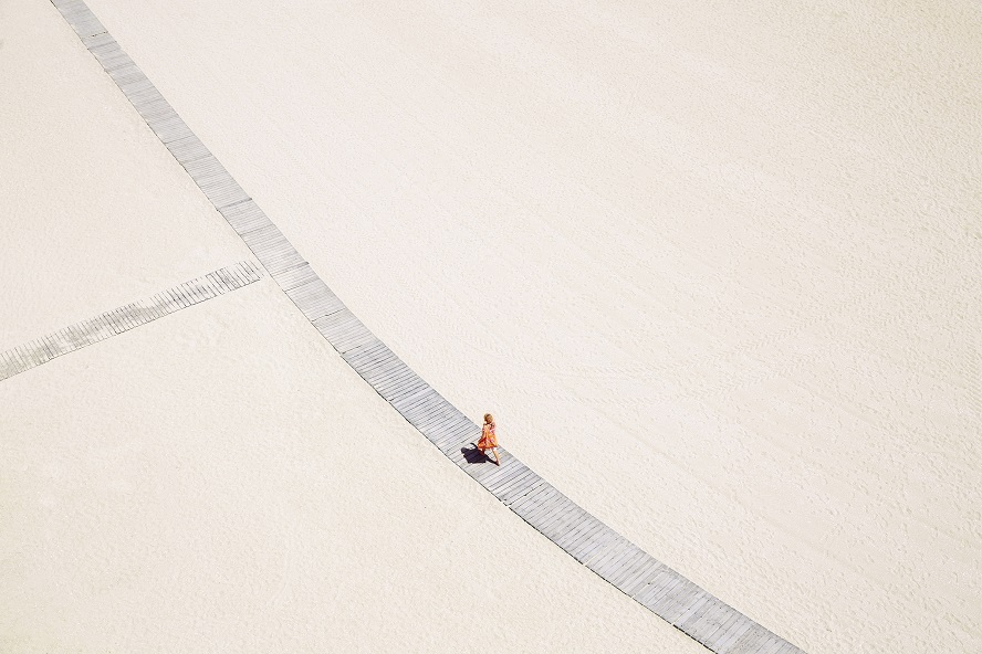 A woman walking on the beach