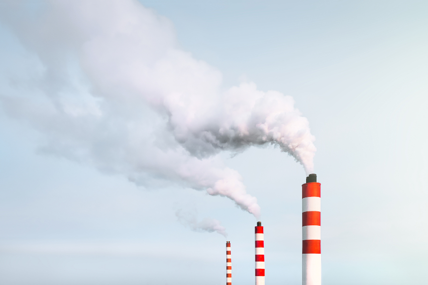 three white chimneys with red stripes