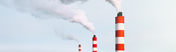 Red and white industrial chimneys