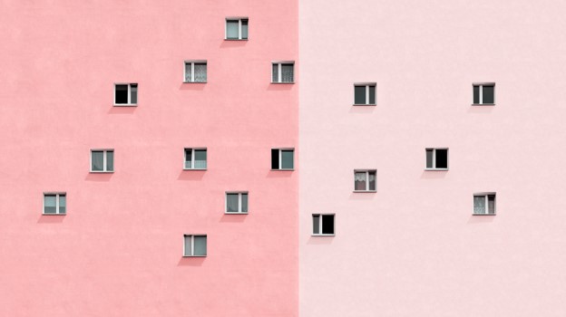 Windows on a pink building.