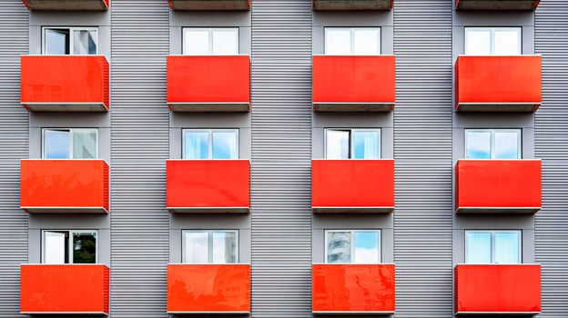 A building with red balconies